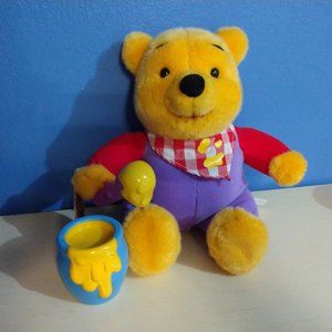 Winnie the Pooh bear collectible toy with honey pot